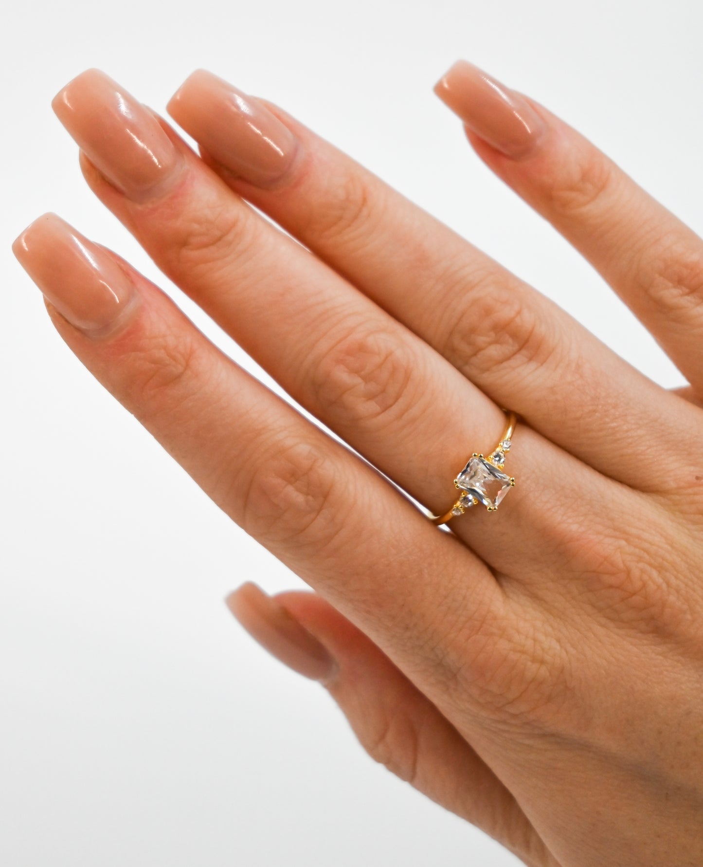 Golden diamond ring on hand