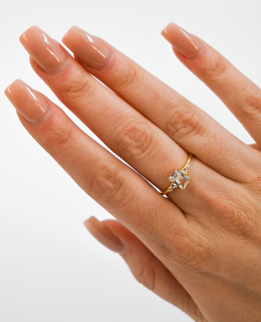 Golden diamond ring on hand